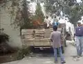 Fig:1 The adobe bricks were transported from Bernardo's house to DIF by a large truck. Four men did the unloading.