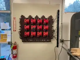 Battery management Custom board and 3D prints to organize, store, and charge M18 Milwaukee batteries.