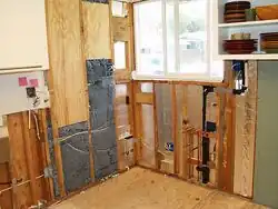 Fig 2: Cotton insulation home installation in progress. From flickr.com[11]