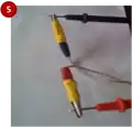 Attach free end of the wire to volt meter leads: Red alligator clamp to red volt meter lead and Black alligator clamp to black volt meter lead.
