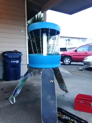 Upcycled Disc Golf An upcycled disc golf basket using skateboards and a 55 gallon drum.