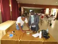 An orthopaedic surgeon drills the bone simulator prototype.