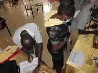 An orthopaedic officer fills the self assessment form after drilling the bone simulator prototype.