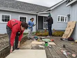 (Left to right) Everett Brown, Jordy Lopez, Sasha Cahill over the Busy Board setup