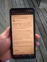 Step 7: Use smart device to search for information within the stored libraries. The user is depicted searching Appropedia for ways to use the sun to disinfect water for consumption.