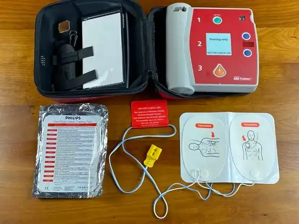 AED trainer with adult pads