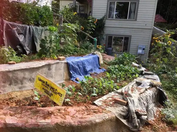 The earthbag terraces here are cracked and covered to protect them from any further damage from the weather.