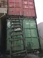 Shipping containers can be stacked to increase storage space per ground area.