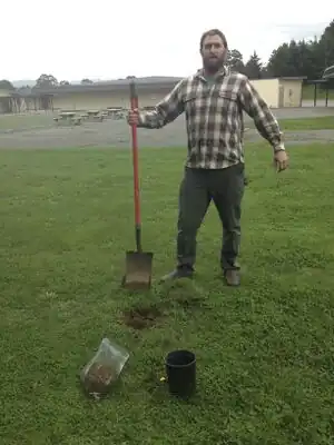 Figure-13: Man collecting soil for soil test.