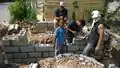 Laying blocks with Jose's help on the side trench.