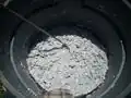 It takes about 5 minutes of mixing with a power drill with a paint mixing paddle for wet shredded paper to pulp like this before adding cement