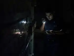 Long-term cost-effectiveness of interventions for loss of electricity/industry compared to artificial general intelligence safety