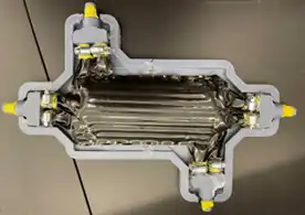 Design, fabrication, and testing of a polymer expanded heat exchanger for absorption chilling