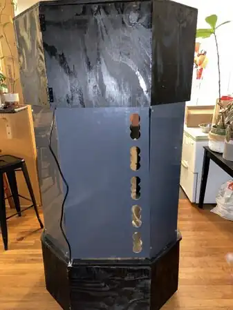 Figure 3) To maximize circular airflow we drilled holes along the left side of the middle sheet.