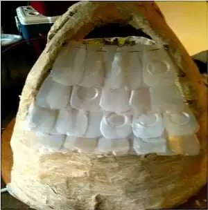 Plastic Plumage and Bird Cage Corrugated plastic shell and one gallon milk carton shingles