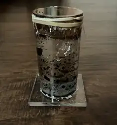 Second prototype of ferrofluid, testing how it behaves in an acrylic container with a saline suspension fluid.