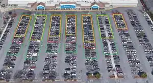 Electric Vehicle Charging Potential from Retail Parking Lot Solar Photovoltaic Awnings