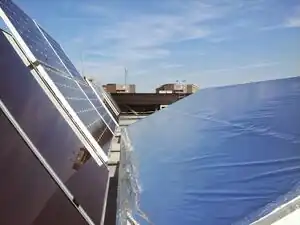 Photovoltaic System Performance Enhancement With Non-Tracking Planar Concentrators: Experimental Results and Bi-Directional Reflectance Function (BDRF) Based Modelling