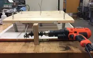 Shake table An earthquake simulator machine that is powered by a drill.