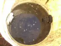 Figure 10 - This picture illustrates the presence of standing water found in the surge tank. Photo by Ben Stern