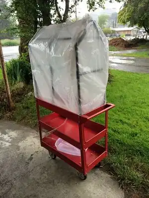 Mobile Greenhouse A mobile greenhouse for starting seeds that wheels from class to sun.